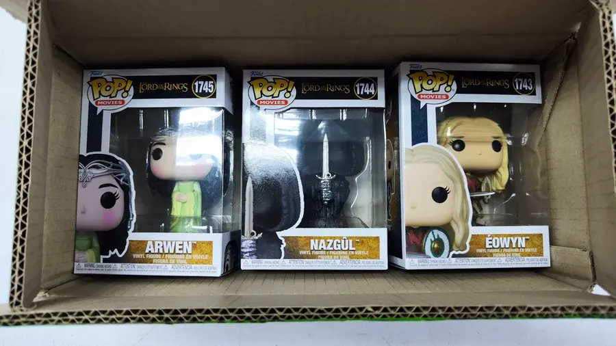 Imported collectible figures inside an opened parcel