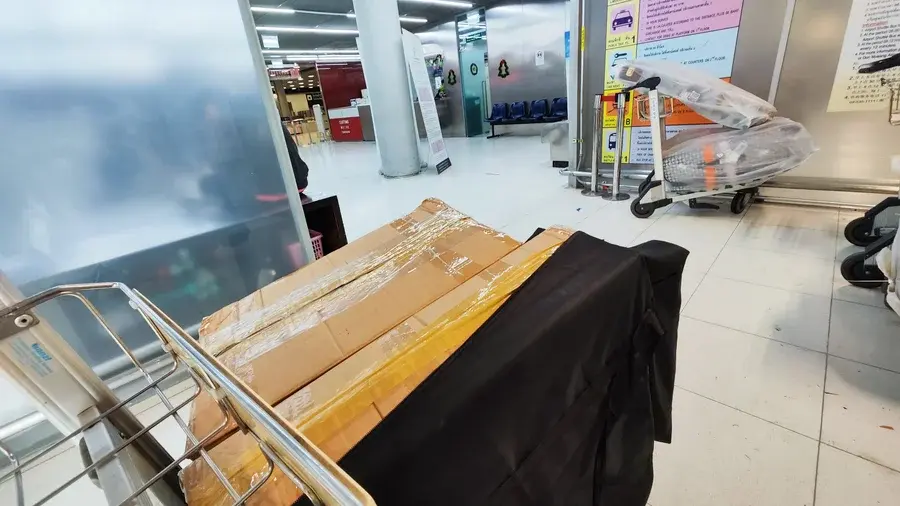 Boxed passenger goods on a trolley at the airport